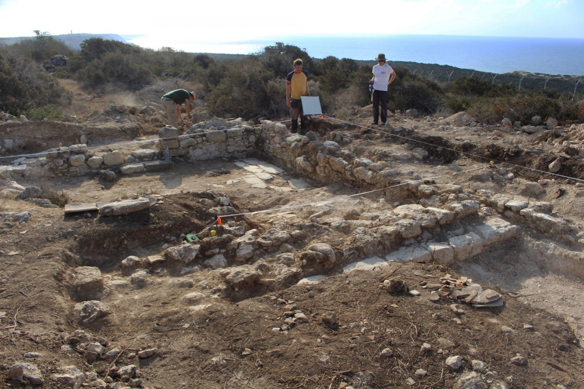 The hilltop building complex overlooking the ancient harbour of Dreamer’s Bay (right background) (photo: Simon James).
