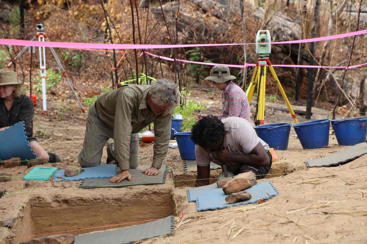 Archaeologists excavate the earth surrounding the cave at Drysdale river.
Photo Credit: The Guardian/University of Western Australia.