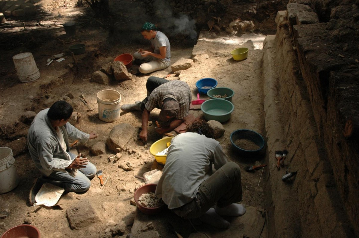 Archaeologists excavate the Royal Palace of Ceibal, which was burned during the classic Maya collapse in the 9th century. Credit: Takeshi Inomata/University of Arizona. 