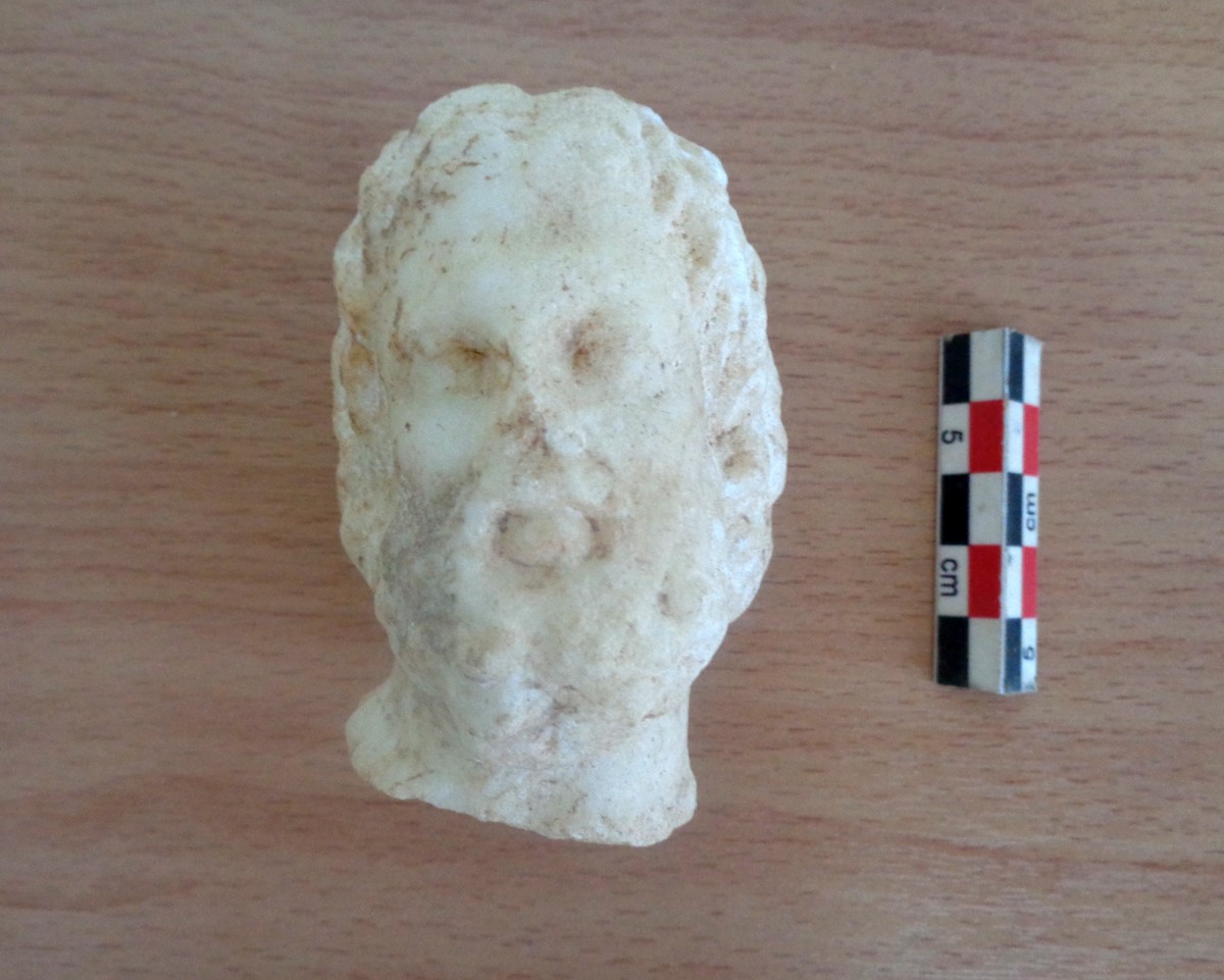 Building 1. Small marble head of a bearded man (Asklepios).