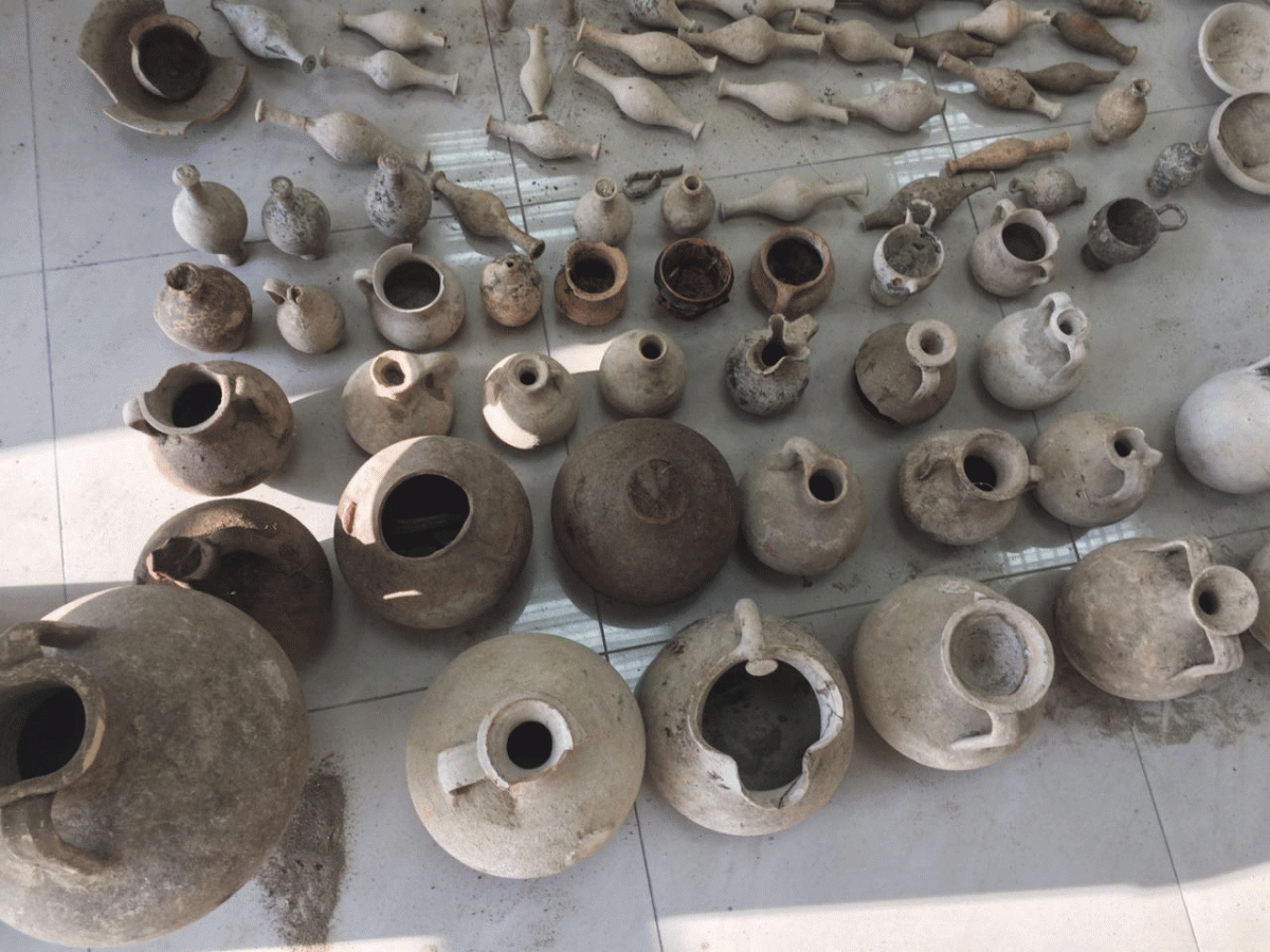 The seized artefacts include iron, bronze and ceramic vases, pots and bottles. Photo Credit: Albania Police/AP/TANN.