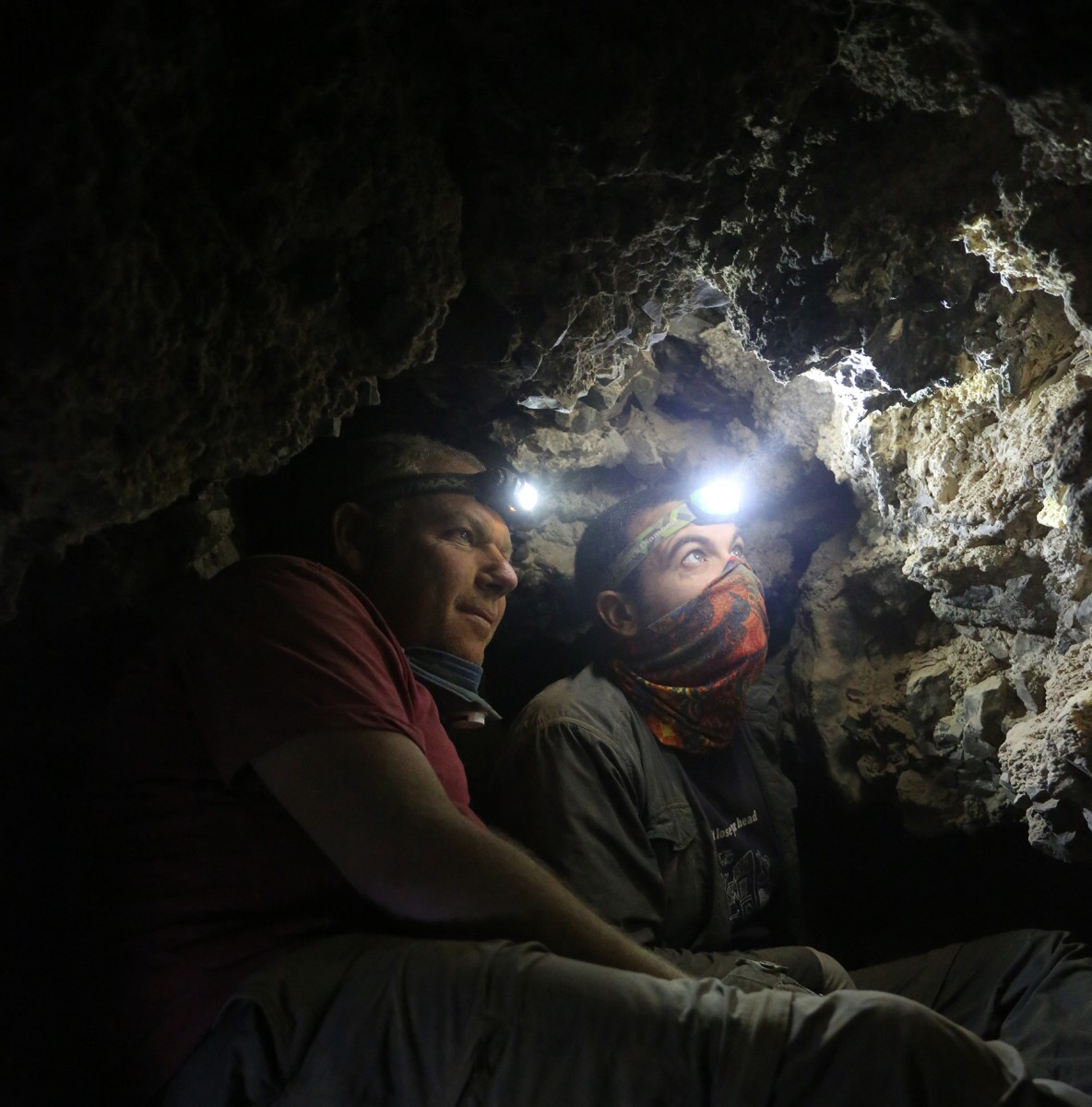 Archaeologists Oren Gutfeld & Ahiad Ovadia survey cave. 