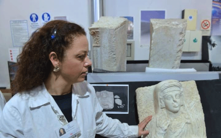 Daria Montemaggiori, a restorer, with the funerary bust of a woman. Photo Credit: Chris Warde-Jones/Telegraph.