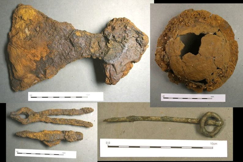 Some of the other finds recovered from the grave (clockwise from the top left): broad-bladed axe, shield boss, ringed pin and the hammer and tongs. Photo Credit: Pieta Greaves/AOC Archaeology/University of Leicester.