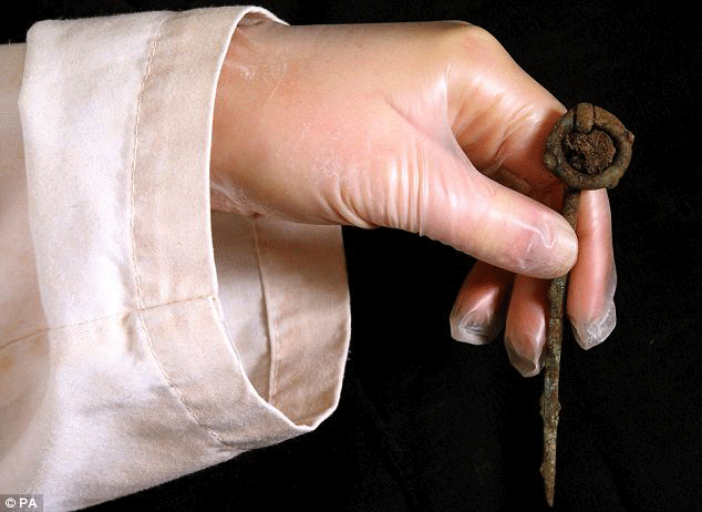A bronze ring pin found at the site that was likely used to fasten a burial cape or shawl. Photo Credit: Daily Mail.