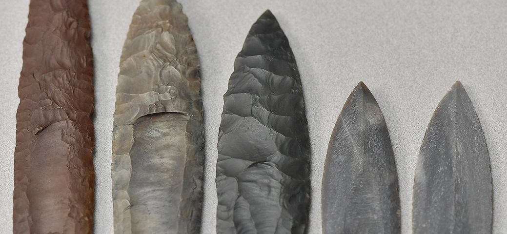 Pictured is a collection of Clovis point replicas and casts in the archaeology lab at Kent State University.