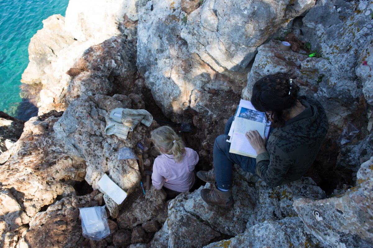 Fig. 14. Excavating the coastal cave on Kythros and conducting geoarchaeological sampling.