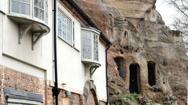 Some houses are built into sandstone rock faces in Nottingham. Photo Credit: BBC.