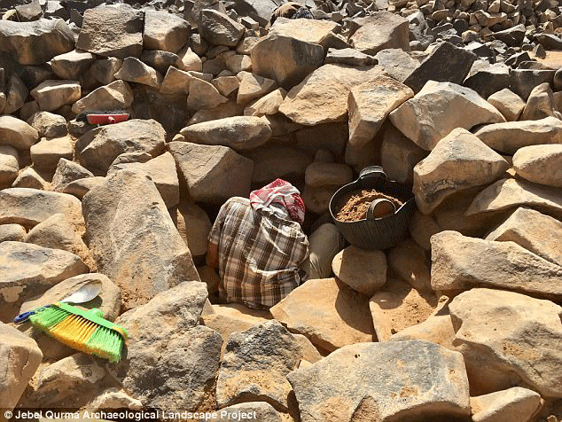 An ancient stone tomb has been uncovered by archaeologists working in Jordan's Black Desert. Photo Credit: Jebel Qurma Archaeological Landscape Project.