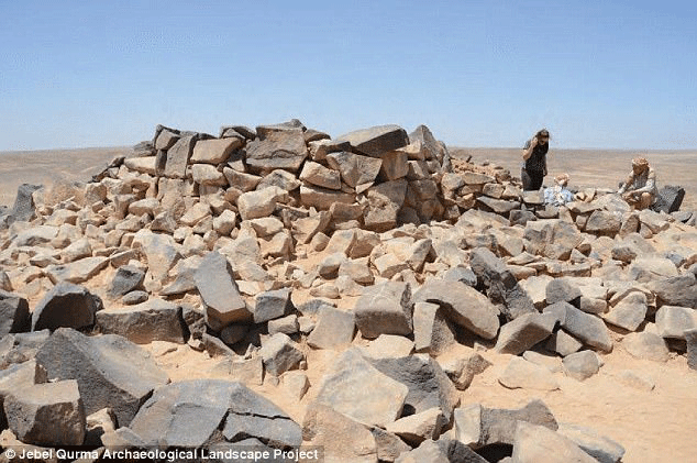 Many of the earlier tombs, dating from before the apparent abandonment of the area, are covered by stone stone piles called cairns. Photo Credit: Jebel Qurma Archaeological Landscape Project.
