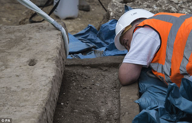 Archaeologists believe it was the coffin of a high status inhabitant of Roman London, but they will not know for sure until the bones and soil inside are tested and dated. Photo Credit: PA/Daily Mail.