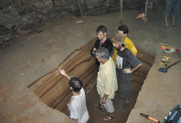 Archaeologist Patrick Daly (wearing hat), Kerry Sieh (pointing), Charles Rubin (second from left), Benjamin Horton, and Jedrzej Majewski (behind Daly) are seen in an Indonesian sea cave. Photo Credit: Earth Observatory of Singapore/Seeker.