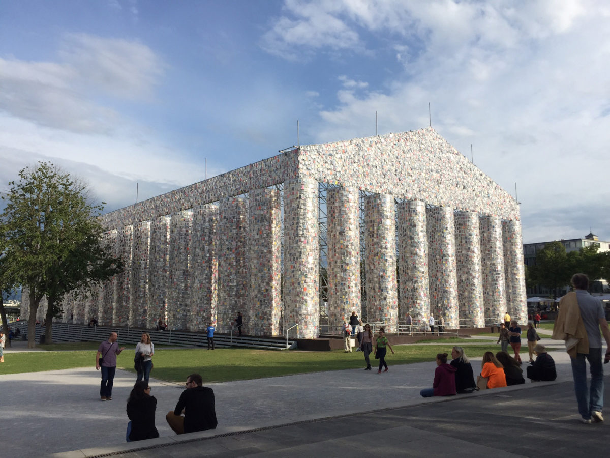 The Parthenon of Books (2017). Steel, books, and plastic sheeting. 19.5 × 29.5 × 65.5 m. Commissioned by documenta 14, with support from the Ministry of Media and Culture of Argentina. Friedrichsplatz, Kassel. Photo credit: K. Charatzopoulou