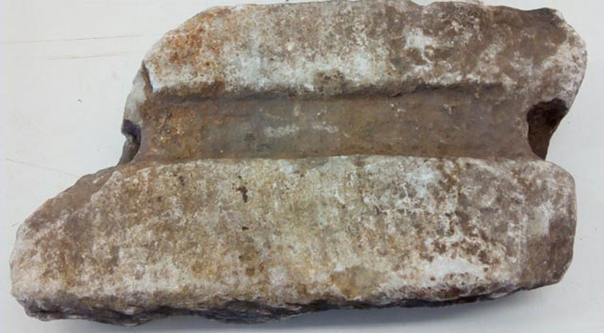 The fragment of the marble water pipe from Ancient Olympia that was recently repatriated.