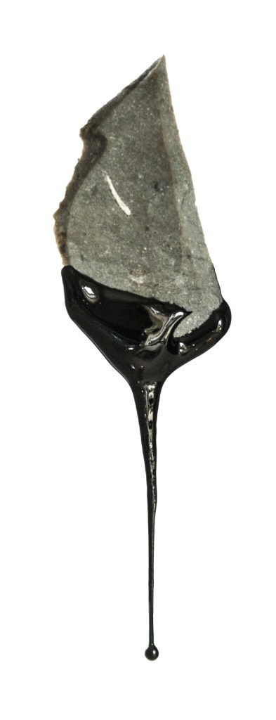 Experimentally produced birch bark tar dripping from a flint flake. Image Credit: Paul Kozowyk/The Seeker.