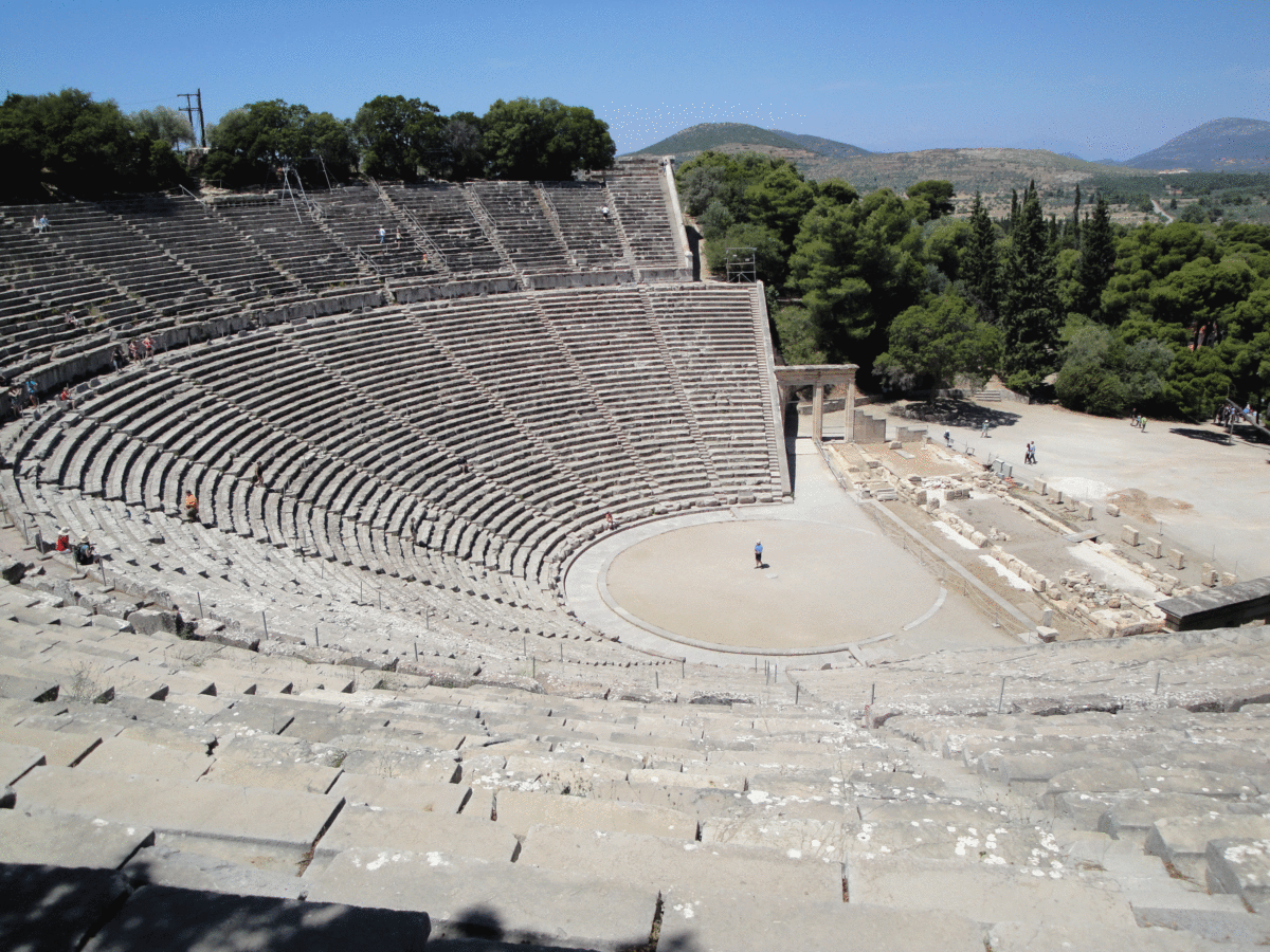 Theatre of Epidaurus: View of the scene (stage), the orchestra (acting area) and the koilon (tiered seats) Photo Credit: Wikimedia Commons.