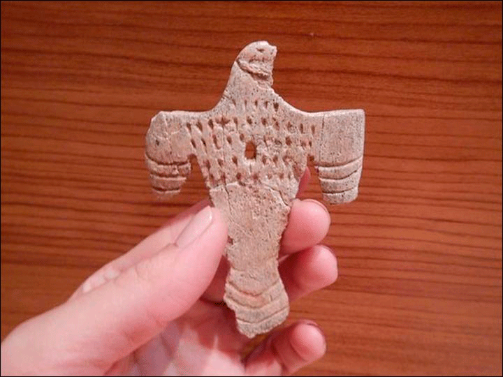 Figurine of a bird made of bone, most likely it was sewn onto clothes or was a kind of pendant. Photo Credit: Institute of Archaeology and Ethnography SB RAS/The Siberian Times.