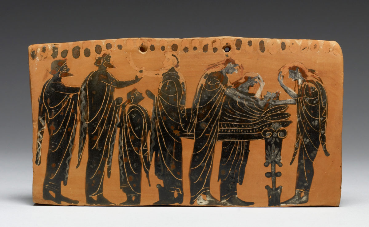 The lying in state of a body (prothesis) attended by family members, with the women ritually tearing their hair, depicted on a terracotta pinax by the Gela Painter, latter 6th century BC.