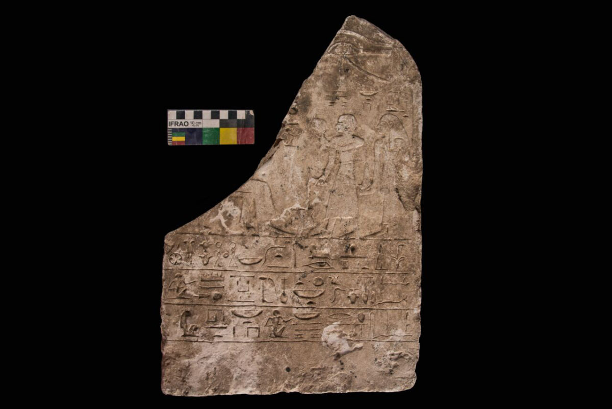 Kom Ombo: limestone stele depicting a man and his wife presenting offerings to a seated deity.