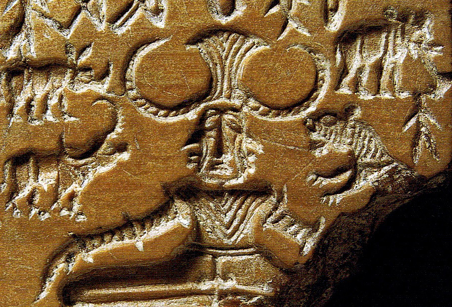 The Pashupati seal, showing a seated and possibly tricephalic figure, surrounded by animals.