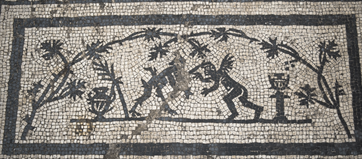 A detail from a mosaic, depicting a satyr and a cupid. Photo Credit: Soprintendenza Speciale Archeologia Belle Arti e Paessaggio di Roma/The History Blog.