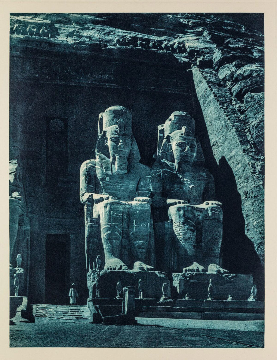 The statues of Ramesses II at the entrance of the Grand Temple to the archaeological site of Abu Simbel, photographed in the moonlight, Egypt 1929. From the book Égypte, published by Paul Trembley in Geneva (1932).