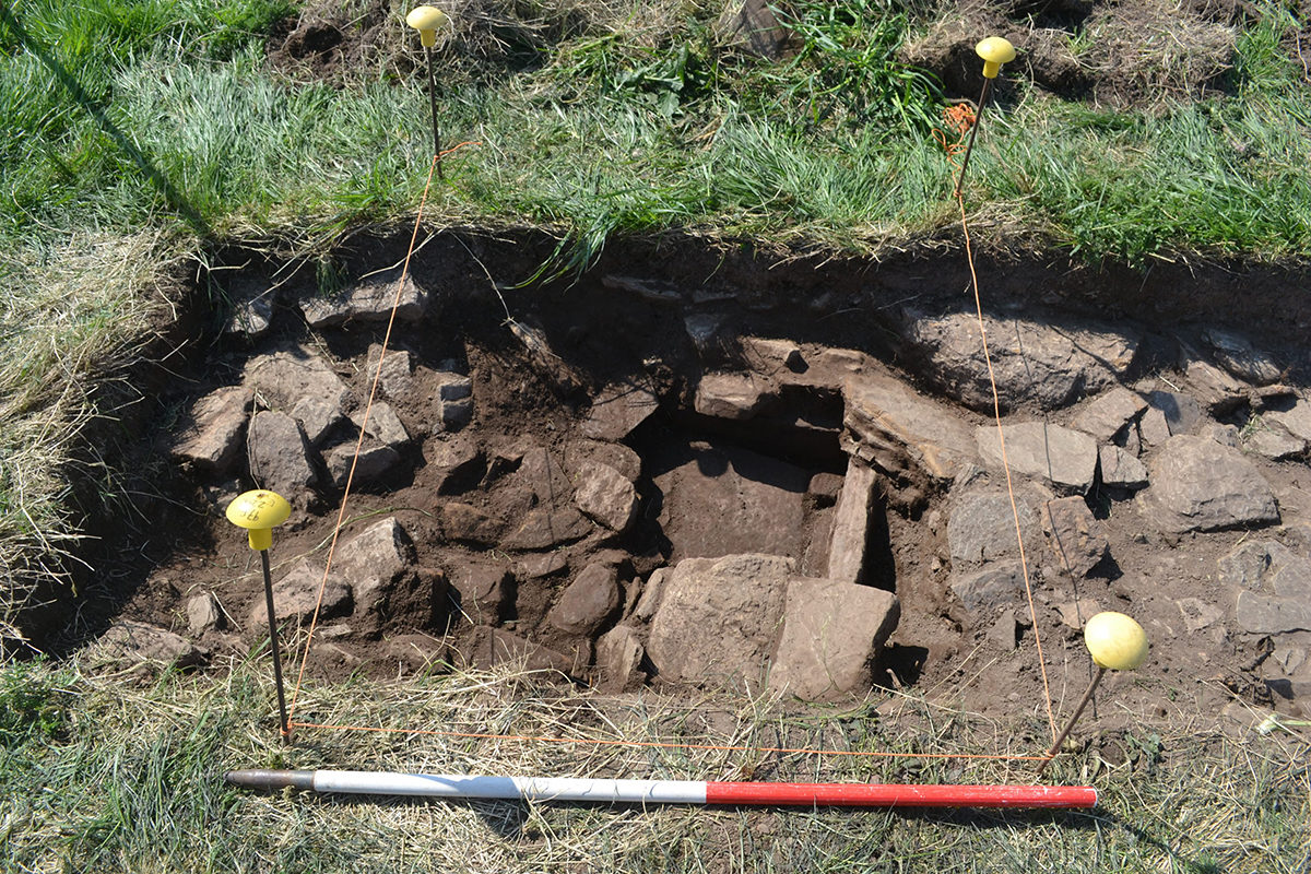 Stone lined hearth emerging from the rubble, Thusater Burn Dig- Credit: Orkney Research Centre for Archaeology