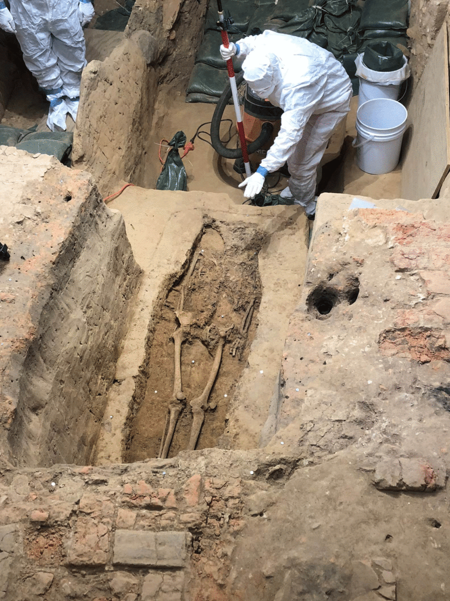 A skeleton is revealed in the excavation of a prestigious church burial at Jamestown, Virginia. Photo Credit: Smithsonian Channel. 