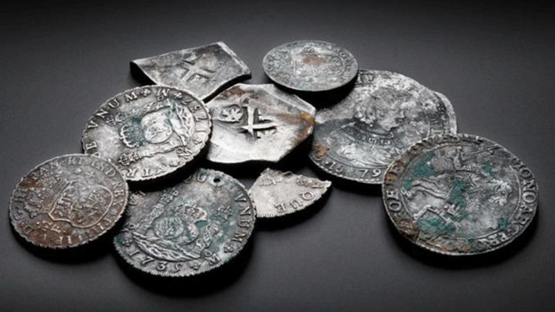 A collection of coins found in the wreck of the Rooswijk. Photo Credit: BBC/Historic England-Cultural Heritage Agency.