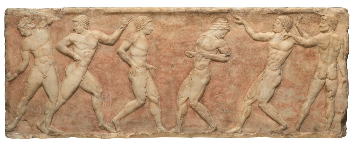 Marble base of a funerary statue of a kouros with representations in relief, 510-500 B.C. Found in Athens, built into the Themistoclean wall next to the millinery factory of E.Poulopoulos. The kouros would have been placed on the tomb of an athlete (©Ministry of Culture, Fund of Archaeological Proceeds, National Archaeological Museum, photo: Yannis Patrikianos).