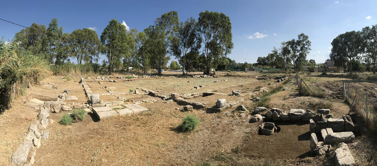 The Sanctuary of Eileithyia, with the entrance and well on the right.