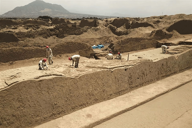 Experts work on the restoration of an ancient structure at the Chan Chan archaeological site, where archaeologists recently 
discovered 20 wooden sculptures, in the outskirts of the northern city of Trujillo, in Peru on October 22, 2018. Photo Credit: AFP / Chris Bouroncle / TANN