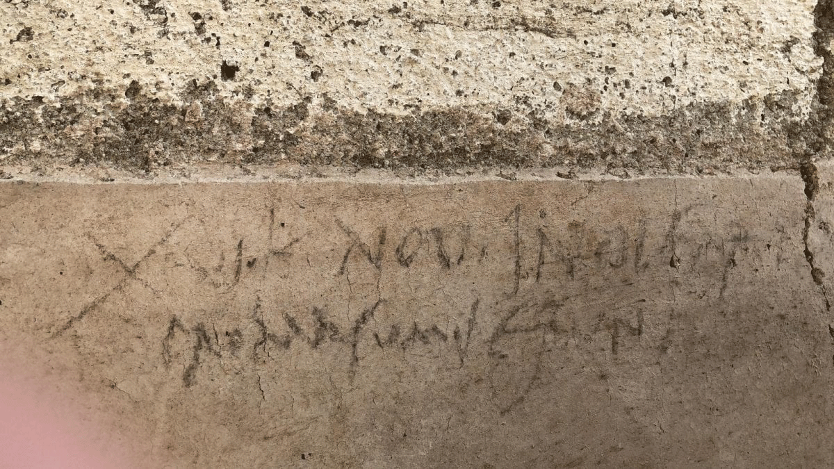 Charcoal inscription dating the eruption of Vesuvius to October. Photo Credit: Ciro Fusco / ANSA.