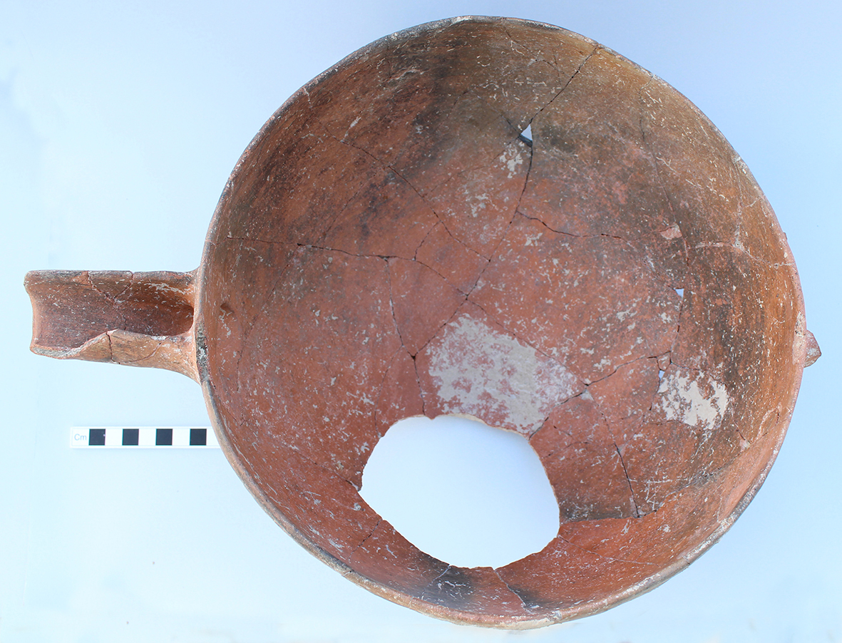Figure 2: Red Polished IV spouted bowl (KS651). The bowl was smashed in place and a fragment deliberately removed during the Bronze Age. The handle was already missing when the bowl was deposited.