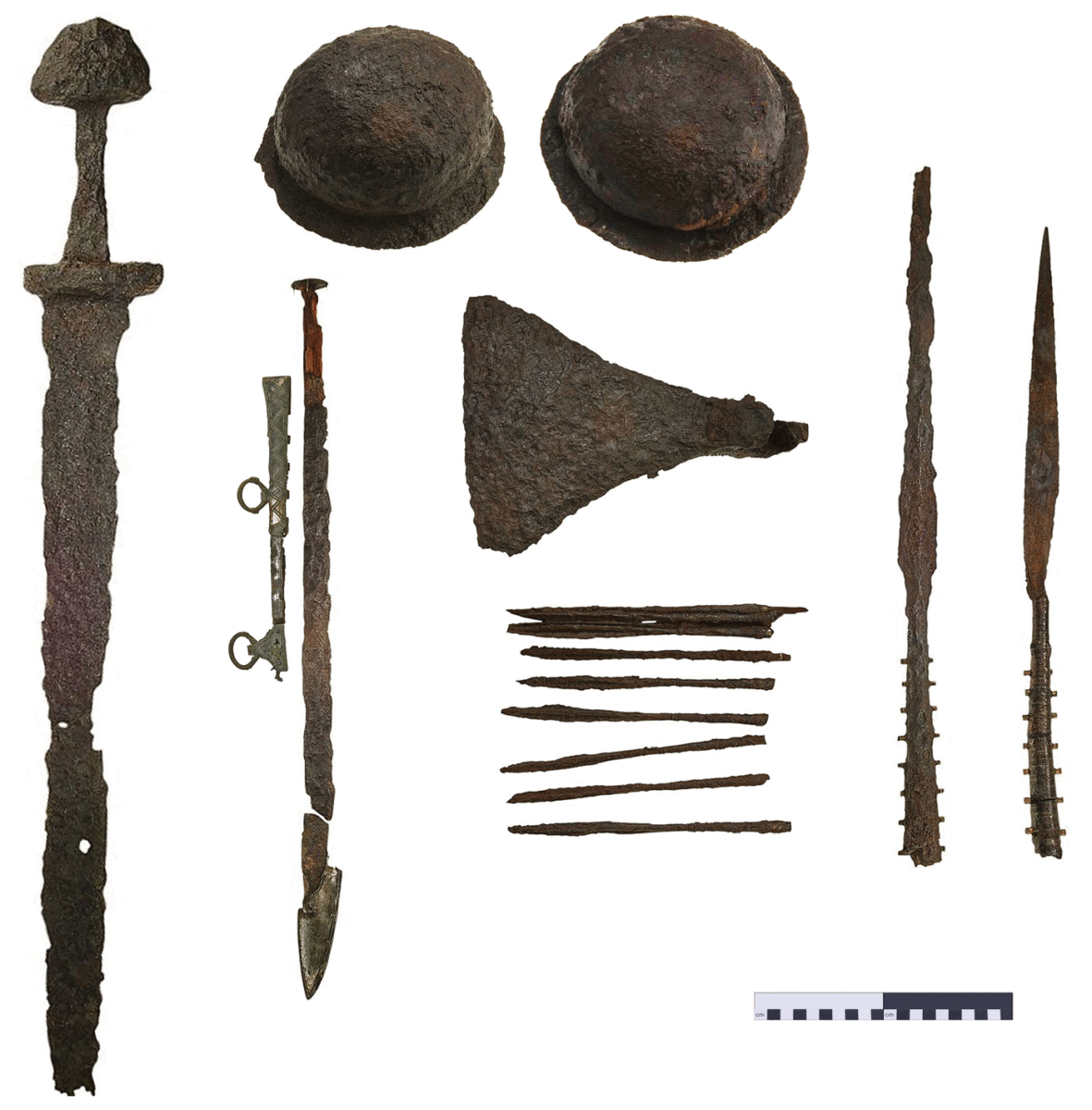 The weapons from chamber grave Bj.581: a sword, axe, fighting knife, two lances, two shields and 25 armour-piercing arrows. Photo Credit: Christer Åhlin/Swedish History Museum/Antiquity.