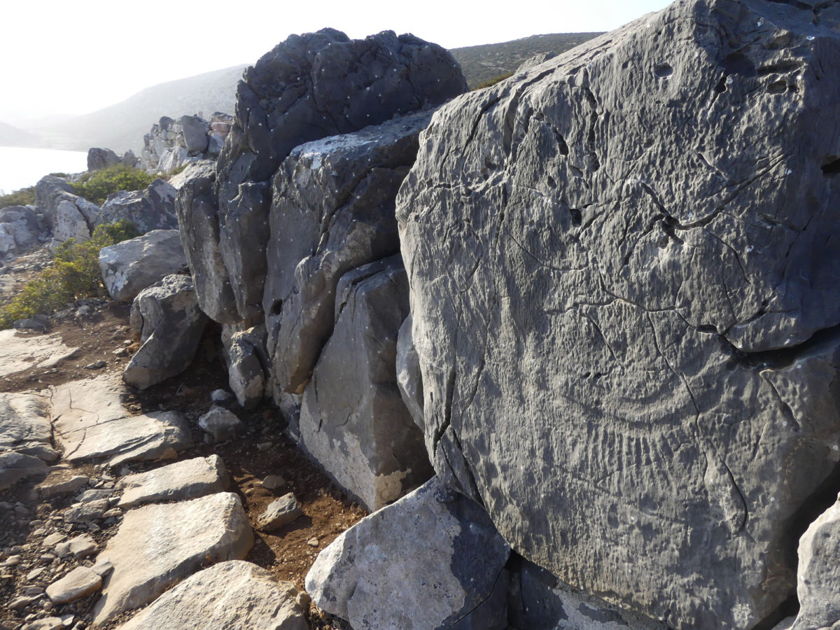 Rock carvings of ships on the acropolis.