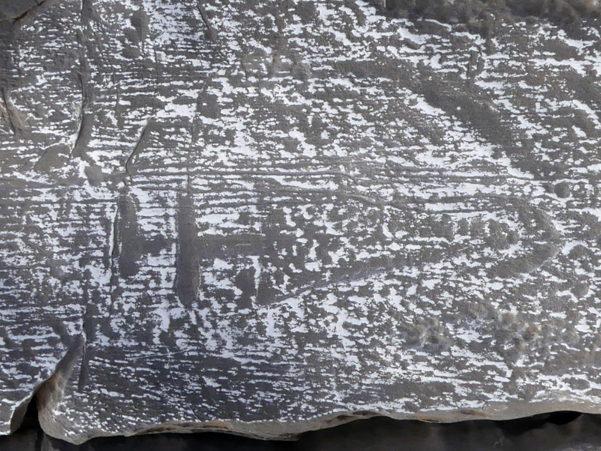 Dagger on rock carving on the acropolis.