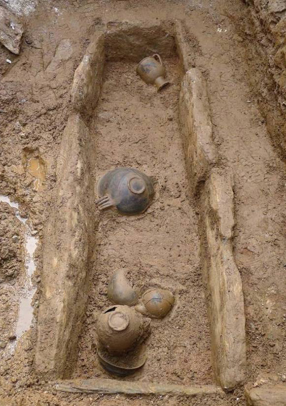 The built limestone cist grave, in which was discovered an unlooted burial in supine position. Photo credit: Ephorate of Antiquities of Lesbos