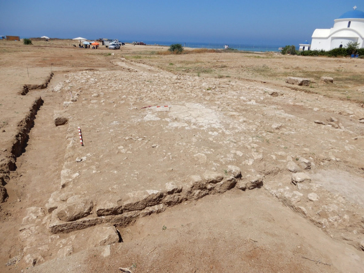 The stone foundation of a cistern. The walls of the aqueduct are visible at the ends.
