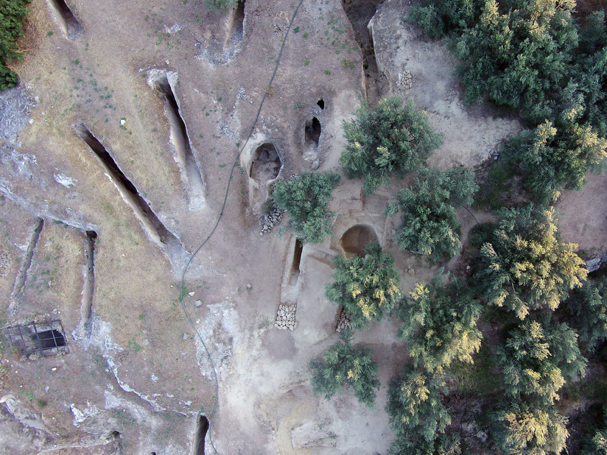 Aerial photograph of the passageway/ dromos and chamber of the two new intact tombs on the east side of the Mycenaean cemetery at Aidonia, Nemea, including the tombs from the earlier excavation (photo: Ephorate of Antiquities of Corinth).