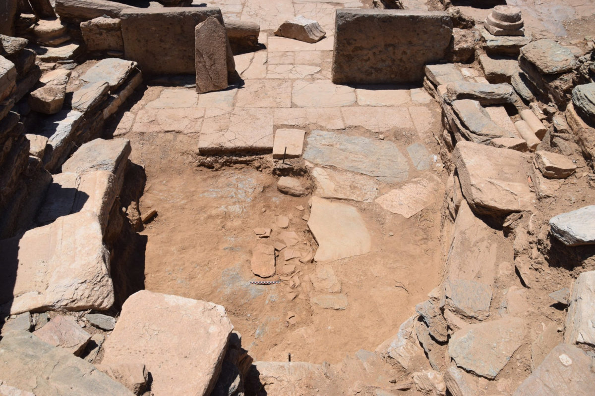 View of the sanctuary apse with part of the layer of fragmented vessels from the consecration case under the paved floor (photo: MOCAS) 