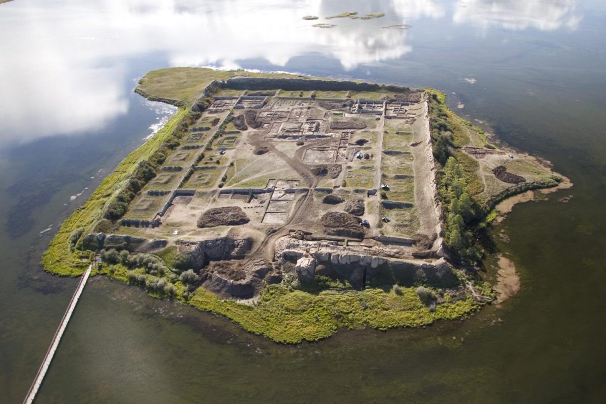 Aerial view of Por-Bajin from the west. The complex is situated on an island in a lake. Scientists have pinned its construction on the year 777 CE, using a special carbon-14 dating technique, based on sudden spikes in the carbon-14 concentration. Credit: Andrei Panin