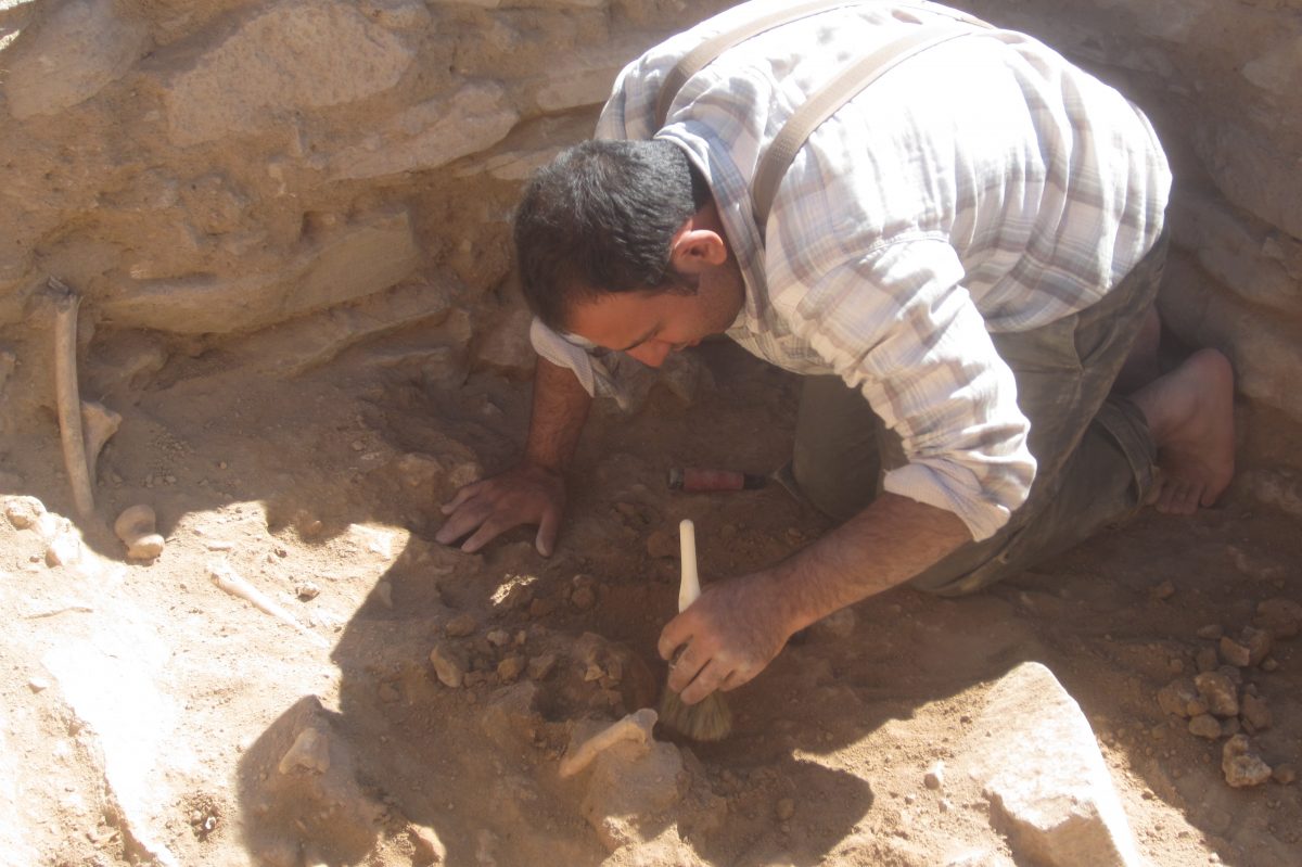 Siavash Samei ’19 Ph.D. excavating one of the graves in the historic Kura-Araxas settlement in Mesopotamia, near the Iran border. (Photo credit: Karim Alizadeh)