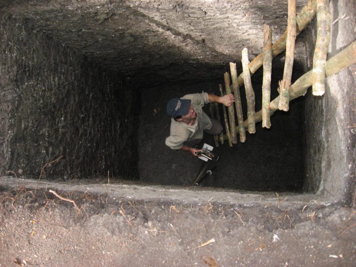 University of CIncinnati graduate student Brian Lane climbs out of the Perdido Reservoir at Tikal. Image Credit: Nicholas Dunning/UC