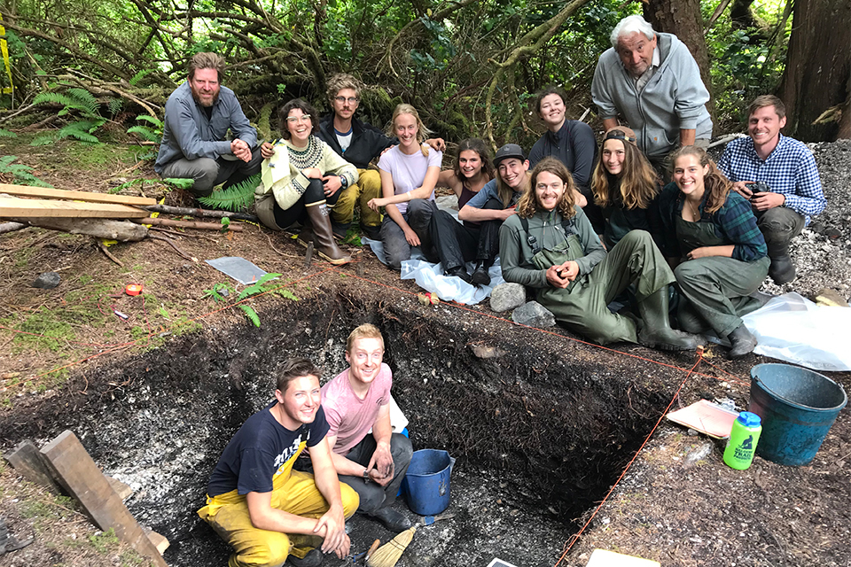 The Keith Island Archaeological excavation showing the 2019 project members from the University of Victoria and project co-directors Iain McKechnie (left), Denis St. Claire (top), and first author Dylan Hillis (reclining). Photo: Anne Salomon