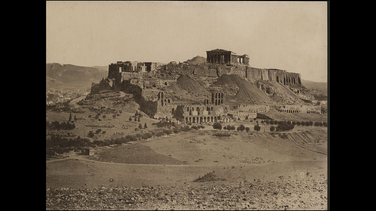 Fig. 17. View of the Acropolis from the SW, with the ruined Serpentzes Wall on the south slope. Photo by D. Konstantinou, ca. 1875, ΕΙΜ Photo Archive.