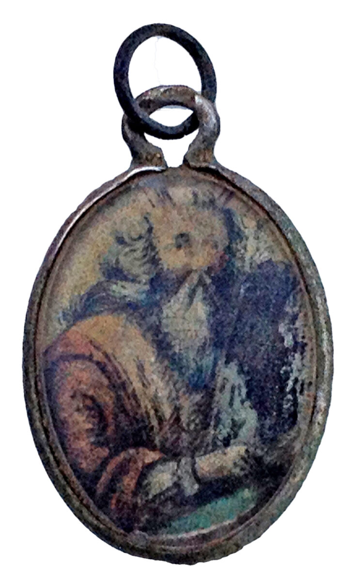 Depiction of Moses and the tablets of the Law on the pendant discovered in the area where women were undressed before being led to the gas chambers. Photo: Yoram Haimi, Israel Antiquities Authority