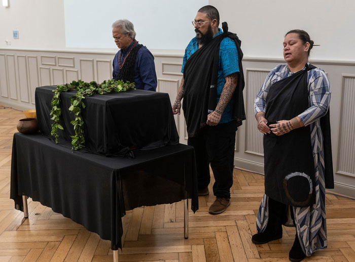 Prayer by the Hawaiian delegation: Edward Halealohu Ayau, Kaleahu Caceres and Mana Caceres. 
Photo: Peter Heller