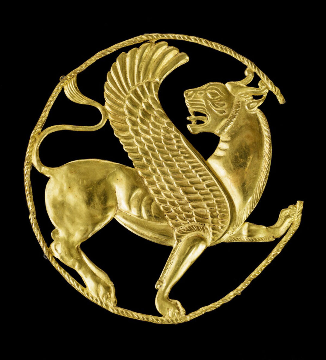 Plaque with a Winged Lion-Griffin, Achaemenid, 500–330 BC. Gold, 1/8 × 4 1/8 × 4 1/4 in. The Oriental Institute of the University of Chicago, A28582, VEX 2021.1.109. Photo: Courtesy of the Oriental Institute of the University of Chicago