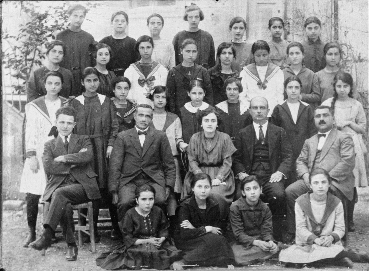 Aivali (Kydonies / Aivalik). The senior class at the Central School for Girls. The author and painter Photis Kontoglou from Aivali sits at the far left of the row of teachers. Centre for Asia Minor Studies